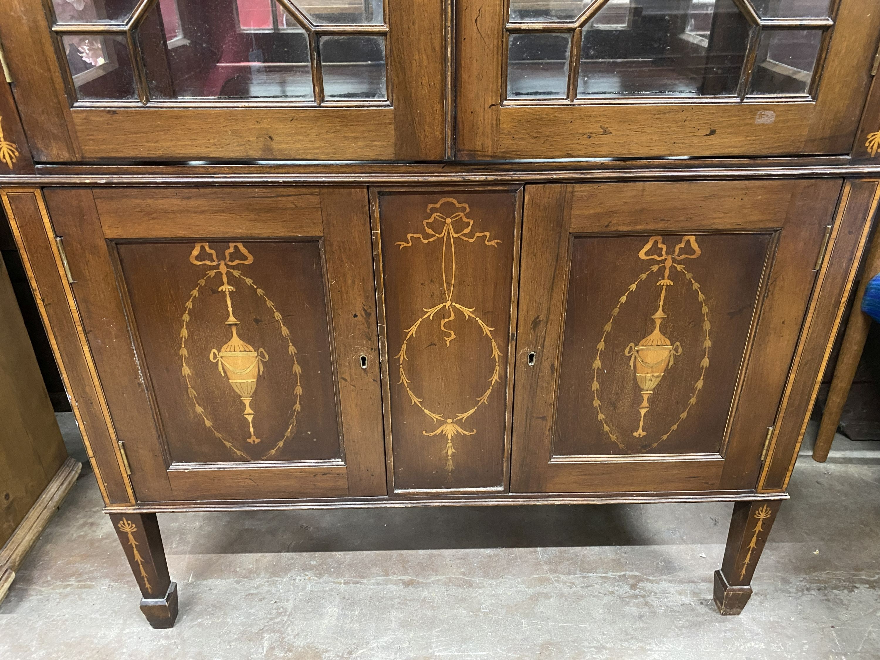 An Edwardian marquetry inlaid mahogany display cabinet, width 94cm, depth 38cm, height 174cm